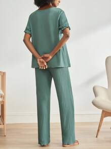 SHEIN BloomMama Conjunto de ropa de estar en casa para embarazadas compuesto por cardigan de manga abullonada de cuello en V de un solo color y pantalones