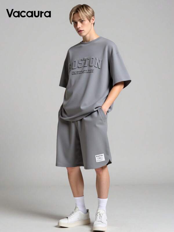 Vacaura Boy Summer Outfit 2pcs Casual Outfit For Teenage Boys, Fashionable Stereo Steel Stamping English Graphic Round Neck Pullover T-Shirt With Curved Side Design, Shorts With Minimalist Textured Trim And Curved Leg, Suitable For Summer And Autumn
