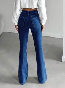 Jeans de algodón elástico con lavado oscuro y talle alto para mujer