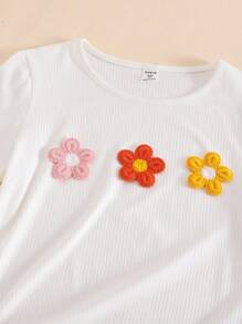 Set de 2 piezas para niñas: Camiseta de manga corta y cuello redondo blanca con decoración floral colorida emparejada con pantalones anchos de pierna ancha con volantes naranja, adecuado para uso de ocio en verano