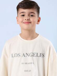 SUMWON قميص بتصميم LA مجموعة الصيف مؤرخ عام 23 ملابس الشارع الحضرية بقصة واسعة مريحة للاستخدام اليومي الأسلوب الحديث للشباب - لون مشمشي - مشاهدة 5