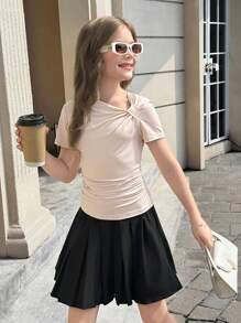 Camiseta informal y elegante de estilo francés para niñas preadolescentes, de punto sólido con un diseño de giro asimétrico en la parte delantera y un hombro asimétrico, perfecta para volver al colegio
