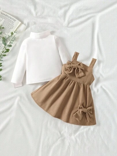 SHEIN Vintaside Kids 女婴休闲简约纹理面料长袖高领上衣搭配厚灯芯绒吊带裙，秋冬公主甜美别致大女孩风格，时尚蝴蝶结对称设计，优雅可爱百搭2024年流行新款