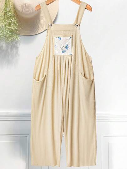 Flirla Mono gris con tirantes de talla grande, estilo minimalista