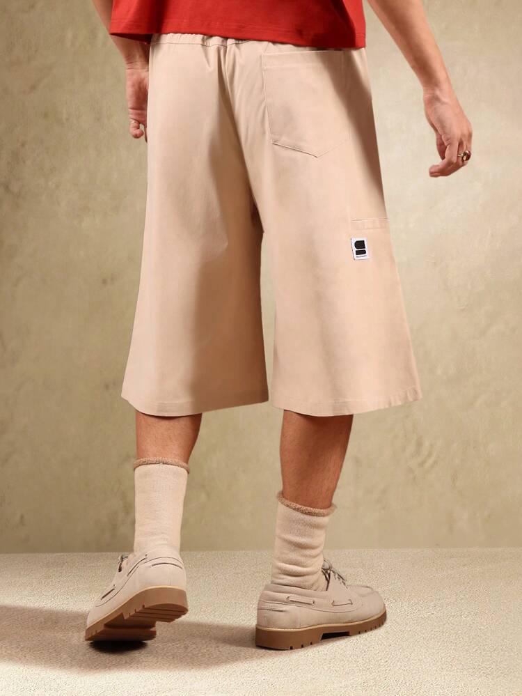 Pantaloncini da uomo oversize a pieghe con gamba larga e lunghezza al ginocchio, tasca per telefono