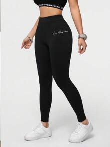 SHEIN Essnce Leggings deportivos casuales con estampado de letras de punto elástico para mujer. Leggings negros para mujer adecuados para salir, ropa de otoño, ropa deportiva femenina - Negro - Ver 1