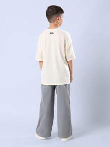 SUMWON قميص بتصميم LA مجموعة الصيف مؤرخ عام 23 ملابس الشارع الحضرية بقصة واسعة مريحة للاستخدام اليومي الأسلوب الحديث للشباب - لون مشمشي - مشاهدة 2