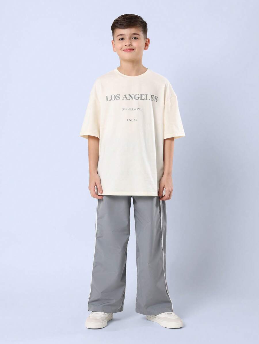 SUMWON قميص بتصميم LA مجموعة الصيف مؤرخ عام 23 ملابس الشارع الحضرية بقصة واسعة مريحة للاستخدام اليومي الأسلوب الحديث للشباب - لون مشمشي - مشاهدة 1