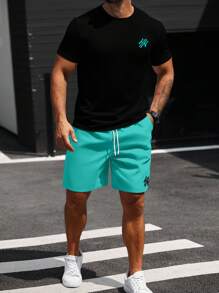 Manfinity CasualCool Conjunto de camiseta casual de manga corta con cuello redondo y estampado de letras, y pantalón corto con cintura con cordón, talla grande para hombre