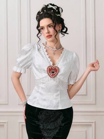 EDITION Blusa con cuello en V, mangas abultadas, encaje y colgante con cristal y cuentas con diseño de corazón y ojo, estilo vintage palaciego para mujer