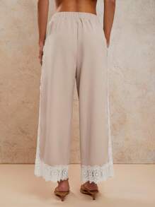 COSMINA Pantalon long pour femmes de style bohème, tenue d'été décontractée pour vacances tropicales, couleur ivoire, patchwork avec garniture en dentelle à l'ourlet - Beige - Voir 2