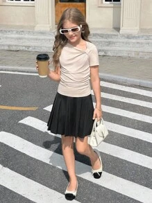 Camiseta informal y elegante de estilo francés para niñas preadolescentes, de punto sólido con un diseño de giro asimétrico en la parte delantera y un hombro asimétrico, perfecta para volver al colegio