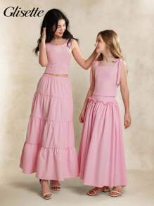 青少年（女孩）两件套服装，春夏休闲优雅，包括粉色无袖蝴蝶结吊带衫和粉色长裙