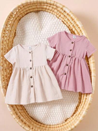 SHEIN 2pcs/Set Baby Girl Soft Cotton Casual Simple Solid Color Button-Front Round Neck Short Sleeve Dress Outfit, Pink & Apricot, 1-3 Years Old, Spring/Summer New Arrival, Convenient Button Design For Easy Dressing, Ideal For Daily Wear Or Outings, High Cost Performance