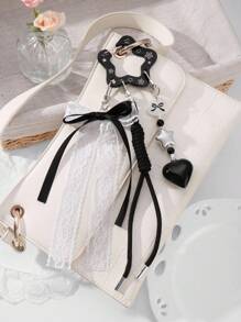 ROMWE Anime 1 pieza Estilo gótico vintage punk negro hueco de acrílico en forma de estrella, corazón, cinta de tul blanco trenzado Llavero DIY, Colgante de bolso, Colgante de teléfono, Regalo para mujeres, niñas, Halloween - Negro - Ver 6