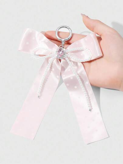 Kawaii 1 pièce Porte-clés pendentif de sac en ruban à nœud blanc à pois roses en cristal de perle fausse de haute qualité, délicate et mignonne. Convient pour le port quotidien des femmes et des filles, cadeau pour les festivals