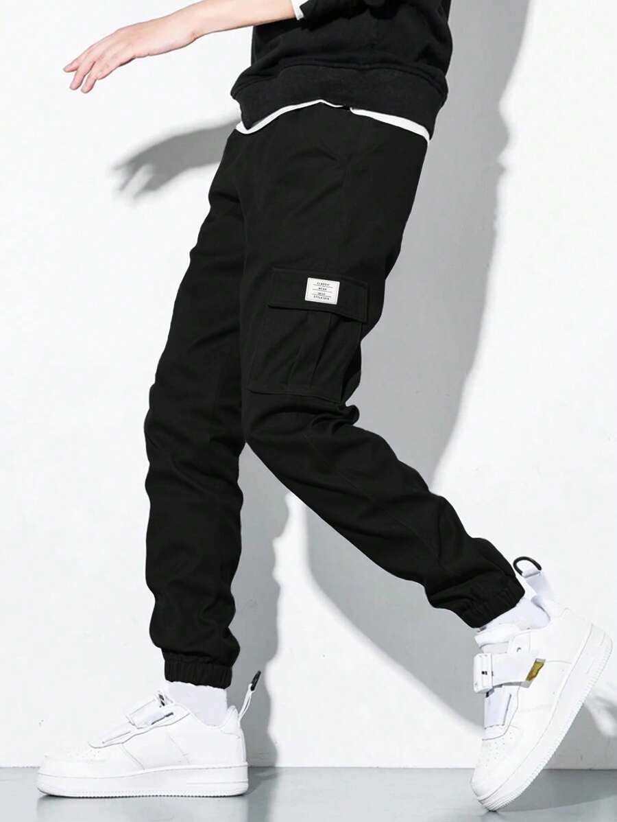 SHEIN Pantaloni da tuta ragazzi cargo con tasche, pantaloni jogger adatti per uso quotidiano, scuola, per tutte le stagioni