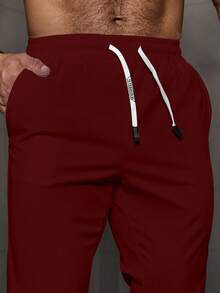 Manfinity Homme Quần tây nam thường ngày có túi rút eo, quần tập gym đa năng, mùa thu - Màu Đỏ Sâu - Xem 5