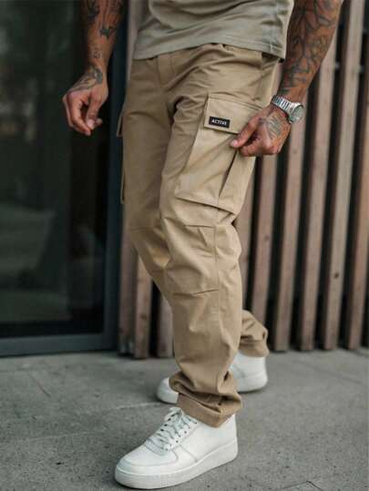 Manfinity Roughcore Pantalones cargo de estilo utilitario de moda casual con pierna recta y múltiples bolsillos, estilo estadounidense, pantalones cargo grises con bolsillo trasero, pantalones de trabajo tácticos para hombres, ropa de calle, otoño