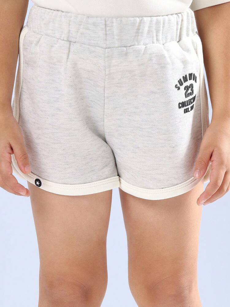 Set coordinato di t-shirt e pantaloncini sportivi a forma di boxy crop top per ragazze