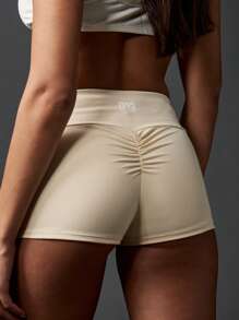 MISSGUIDED Pantalones cortos deportivos mini con pliegues en el trasero, cintura alta, compresión, para correr, yoga, entrenamiento, actividades de estudio, ropa deportiva que absorbe la humedad y se ajusta al Body - Albaricoque - Ver 1