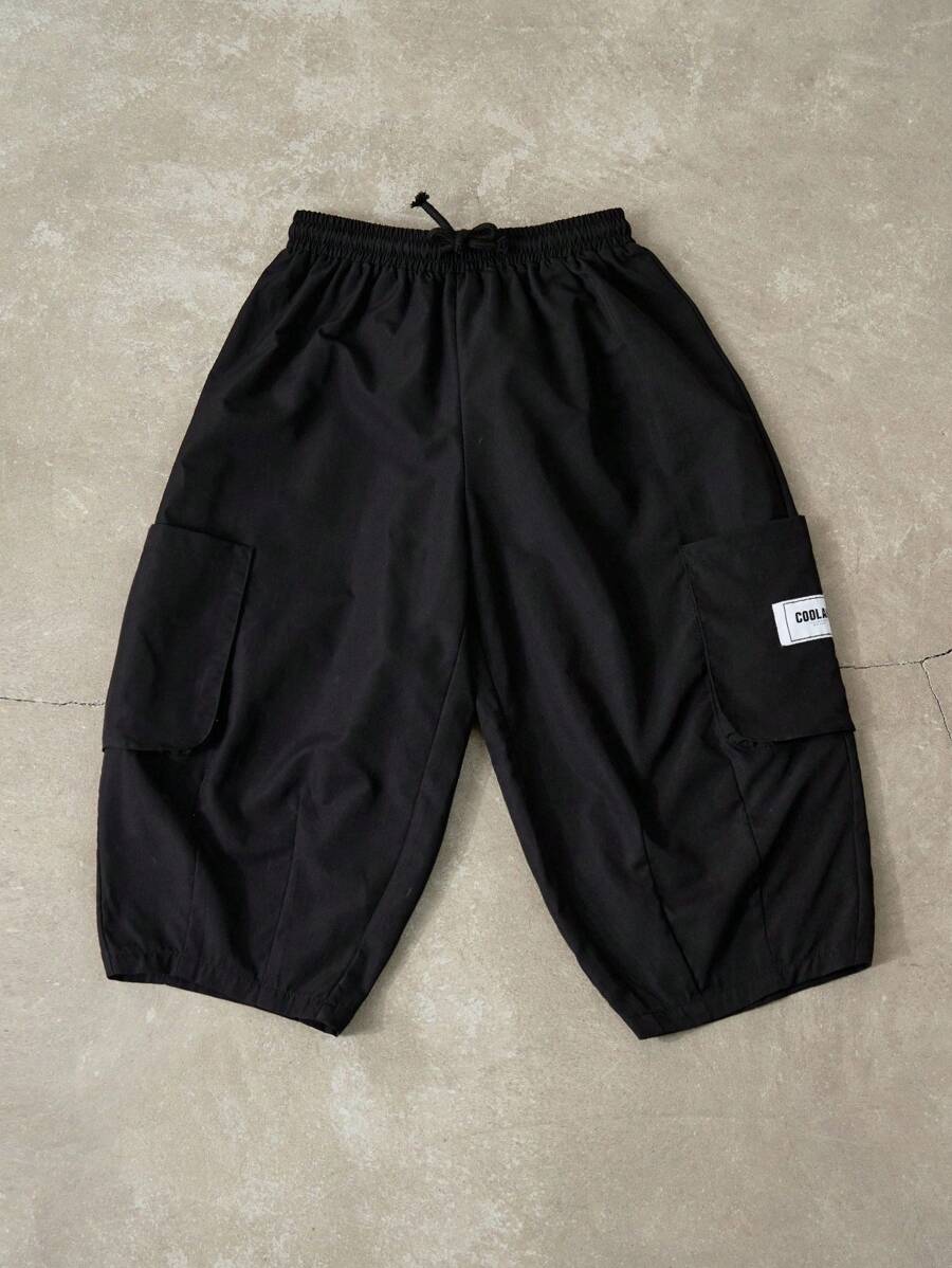 SHEIN Tween Boys Spring/Summer Dual Pocket Pants Straight Leg Drawstring Cargo Plain Black,Capri Pants, Modify Leg Shape, Tapered Cuffs - Black - View 1
