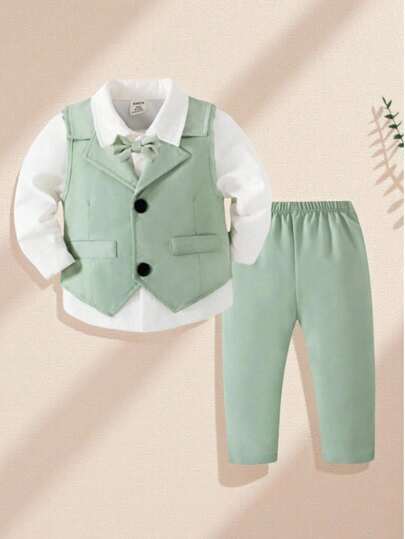 男婴两件套柔软休闲西装套装，包括浅绿色背心和带黑色纽扣的配套裤子，适合婚礼、婚礼宾客、戒指持有人、花童服装等正式或非正式场合