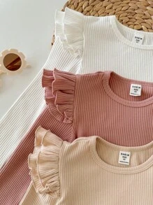 SHEIN 女婴时尚可爱精致小飞袖荷叶边家居三件套休闲纯色针织长袖上衣，多色时尚百搭秋冬款，柔软面料呵护宝宝娇嫩肌肤，是妈妈们的首选。买二送一！女婴时尚长袖上衣，女婴荷叶袖上衣，女婴长袖衬衫，幼儿荷叶袖上衣，新生儿女婴长袖衬衫，女婴罗纹上衣，秋季款 - 彩色 - 查看 3