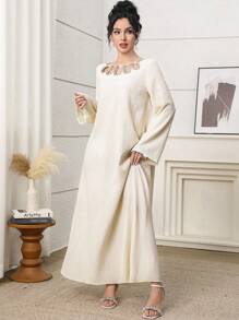 Al Najma Elegant Yellow Modest Abaya Dress For Women, Featuring A Unique Round Neckline With Pearl Beaded Cut-Out Details. This Long Sleeve Woven Fabric Gown, With Its Semi-Sheer And Subtle Rib-Knit Texture, Offers Grace And Style. Kaftan Jalabiya Dress - Yellow - View 4