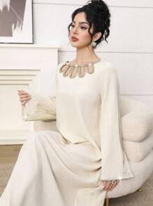 Al Najma Elegant Yellow Modest Abaya Dress For Women, Featuring A Unique Round Neckline With Pearl Beaded Cut-Out Details. This Long Sleeve Woven Fabric Gown, With Its Semi-Sheer And Subtle Rib-Knit Texture, Offers Grace And Style. Kaftan Jalabiya Dress - Yellow - View 2