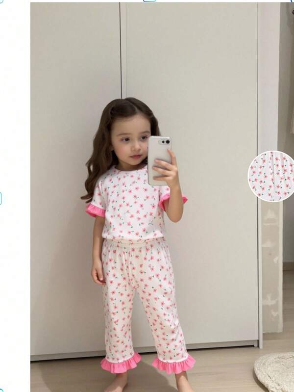 Conjunto de 2 piezas de top de manga corta blanco con estampado floral sencillo y pantalones para uso en casa para niña