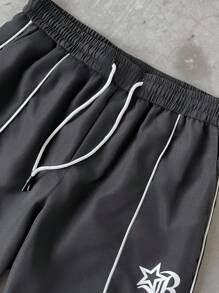 Manfinity EMRG Pantaloni casual da uomo con stampa a strisce laterali color contrasto