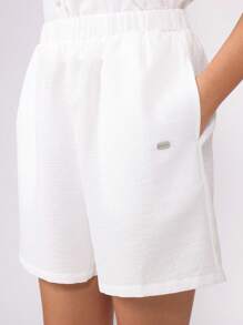 SUMWON Minimalistischer Knopfvorderseiten Weste Zwei-Teiler Sommer Set mit maßgeschneiderten Shorts, Strand Resort Urlaubsmode, lässiges Wochenend Co-Ord - Weiss - Übersicht 7