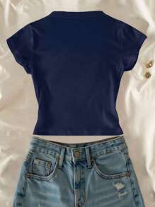 SHEIN Top corto ajustado informal con estampado gráfico de flor de lirio para niñas preadolescentes
