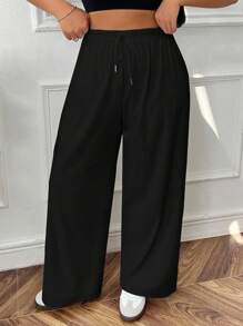 Calça de moletom plus size com amarração frontal e cor sólida simples e casual