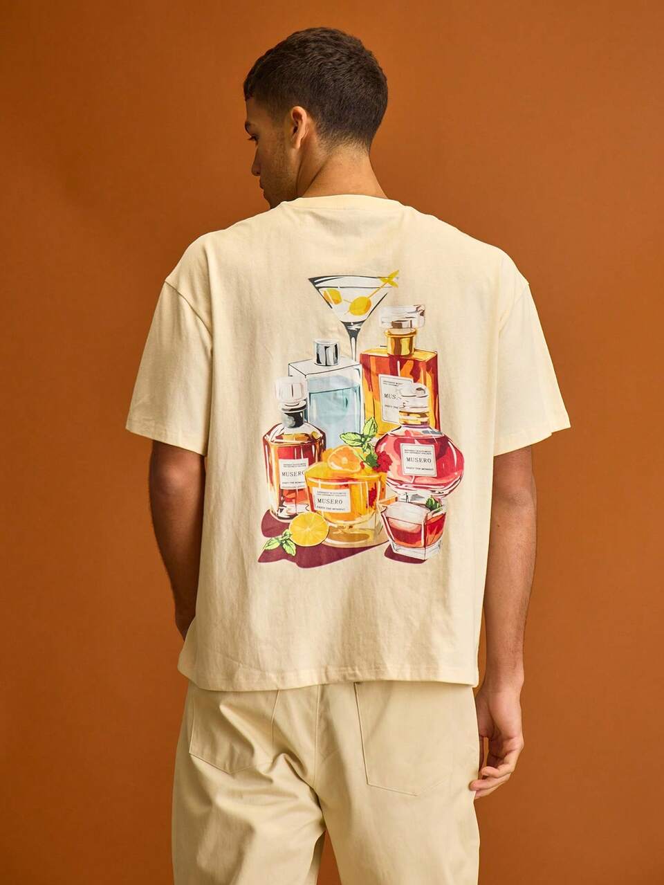 T-shirt oversize da uomo con grafica a blocchi, maniche corte, spalle cadenti, adatta per l'estate e le vacanze