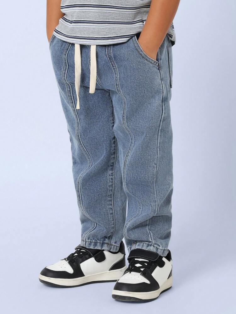 Jeansy typu slouchy z falowanymi przeszyciami i ściągaczem w pasie