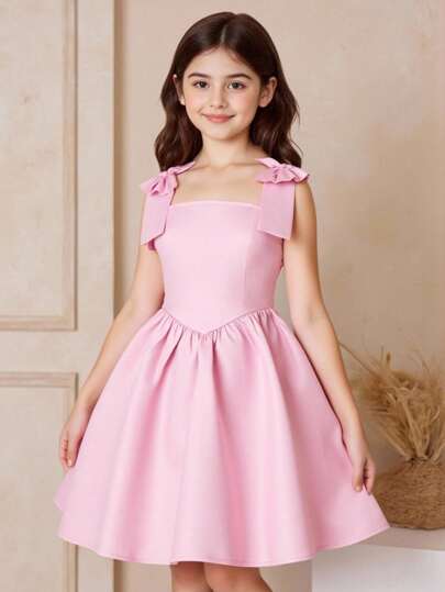SHEIN Vestido de fiesta de satén elegante con detalle de lazo y tirantes de espagueti para niña preadolescente, color rosa