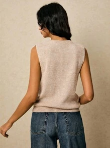 Poéselle Áo vest len kaki với cúc kim loại hình mặt trời, áo vest dệt kim khoét lỗ cài hoa | Áo tank top len không tay màu be, trang phục nữ mùa thu, trang phục công sở thường ngày, áo len nữ kiểu giáo viên, áo len không tay khoét lỗ trang trí kim loại hình mặt trời cho nữ, áo vest len, áo len khoét lỗ, áo len không tay, áo len màu trung tính, phong cách sang trọng tinh tế, đơn giản và thời trang, phong cách cổ điển, phù hợp cho mặc hàng ngày, đi chơi, đi làm, hẹn hò, ở nhà và các dịp khác. - Màu Khaki - Xem 9