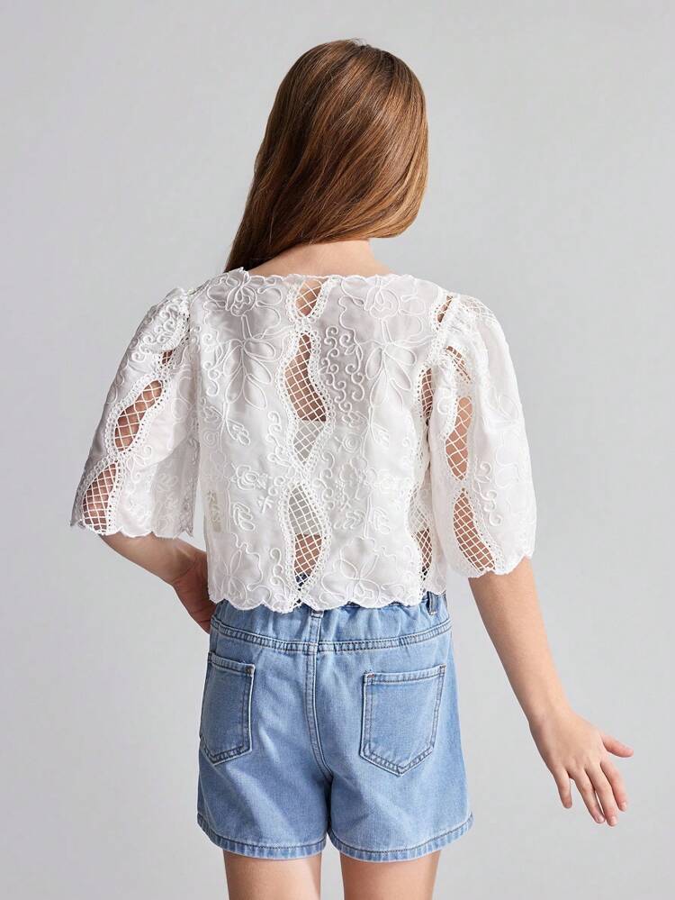 Adorable White Eyelet Cropped Top For Kids, Featuring A Sweet V-Neckline With Bow Tied Lace-Up Front And Scalloped Edges, Ideal As Stylish Summer Beachwear.