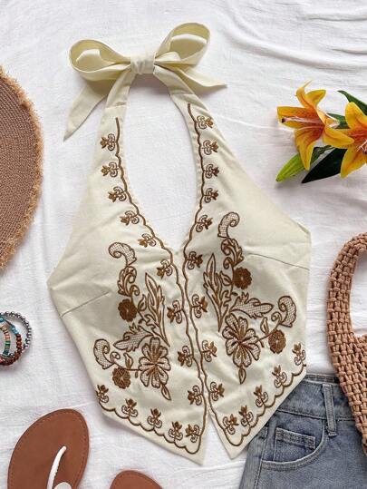 Soleia Top corto para mujer estilo bohemio sin mangas con diseño de espalda de tirantes, cuello halter con diseño anudado y bordados florales, adecuado para festivales de música