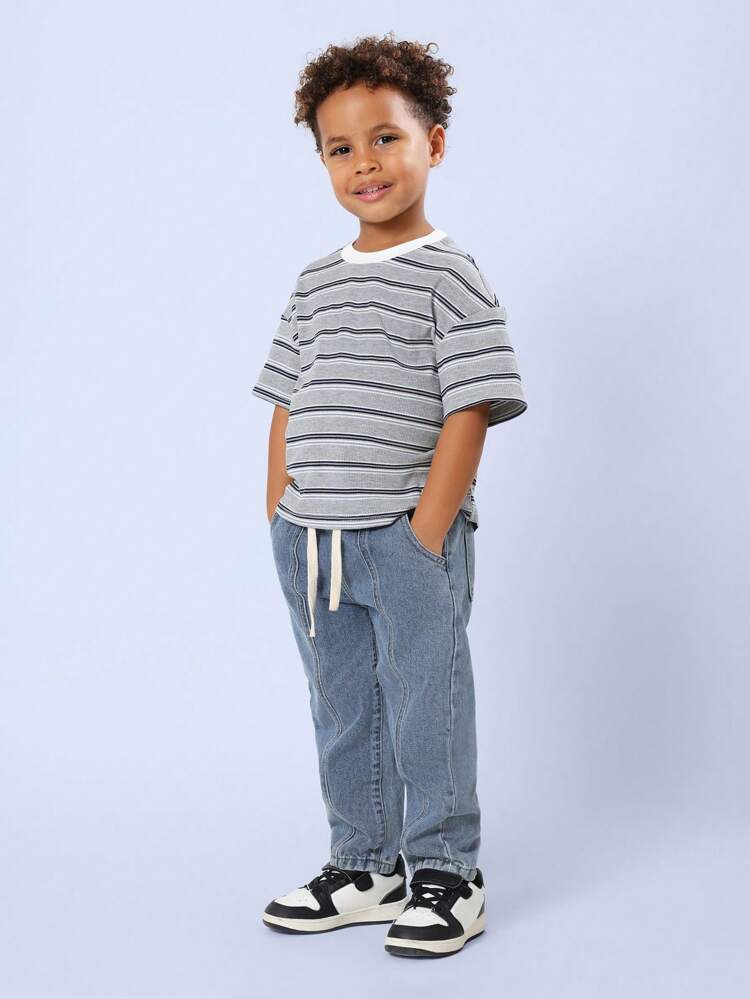 Jeansy typu slouchy z falowanymi przeszyciami i ściągaczem w pasie