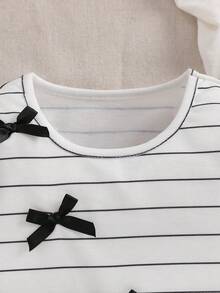 SHEIN Baby Girls' 3D Bow Decor Long Sleeve Sweatshirt. The 3D Bow Design Adds Endless Childlike Charm. Round Neck Style, Simple And Fashionable, Suitable For Outdoor Play, Home Leisure, Party Attendance And Various Occasions, Making The Baby The Little Focus In The Crowd And Displaying Lively And Adorable. - Black and White - View 3