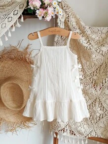 SHEIN Vintaside Kids 1 件装女婴无袖细肩带连衣裙，甜美淑女风格褶皱柔软材质蝴蝶结短款 A 字形荷叶边下摆连衣裙，适合日常、旅行、度假、百搭夏季新品的休闲装 - 杏色 - 查看 1