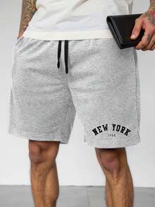 Manfinity Homme شورت كاجوال مرتفع الوسط بنقشة حروف...