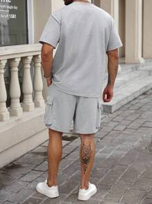 Manfinity Homme Große Größen Herren Lässig Set aus T-Shirt mit Tasche und Shorts mit Tasche