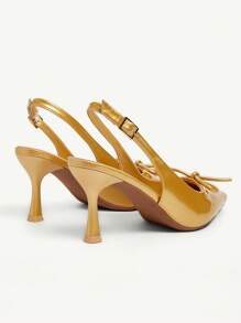 CUCCOO CHICEST Chaussures à talons hauts pour femmes avec nœud  enrobé noir, bout pointu, design ajouré et talon bottillon. Mode blogueuse, convient pour le travail, les tenues de cérémonie, les soirées et les rendez-vous