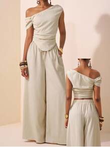 Zivah 2 件/套 2025 春夏新品系列音乐节、复活节、圣帕特里克节、西部风格、游牧风格、生日派对、毕业季、学院风、学生装、日常休闲、基本百搭、休闲、度假、邮轮旅行、海滩、日光浴、病毒式、街头服饰、婚礼嘉宾波西米亚风格、通勤风格、早午餐装、机场装 - 米色不对称肩部设计褶皱下摆短款上衣和阔腿裤纹理面料两件套 - 杏色 - 查看 6