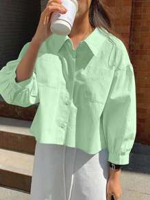 Jouncy Camisa suelta de manga corta de un solo pecho con bolsillo de unicolor para mujer