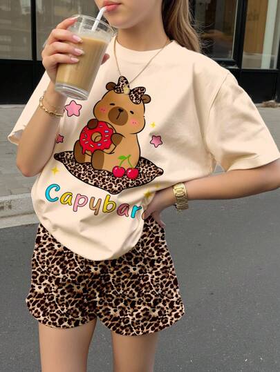 SHEIN Cute Capybara Leopard Print, Adorable Cherry Bow Accent, Chic Kawaii Style, Tween Girl Casual Minimalist Short Sleeve Top And Shorts Set, Suitable For Summer, Chill Chill Summer, Summer Getaway, Vacay Vibes, Summer Holiday Kawaii Shirt Cartoon Graphic Tee Tween Girls Casual Printed Short Sleeve Capybara Clothes Kids Leopard Print Shorts